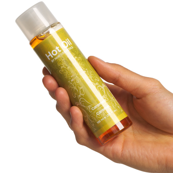 NUEI Huile de Massage Chauffante Parfumée Image du produit avec des mains 50